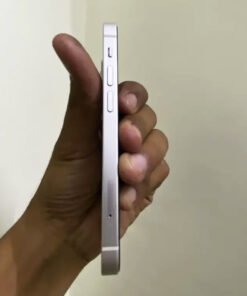 Left aluminum side frame of a Starlight iPhone 13 mini showing the mute switch, volume buttons, and SIM card slot.