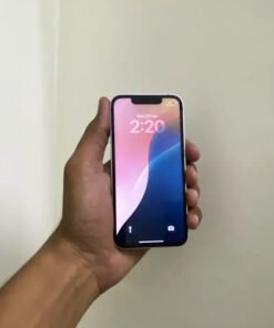Front lock screen view of a PTA approved Starlight iPhone 13 mini displaying a vibrant wallpaper and smaller top notch.