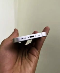 Bottom edge view of a Starlight iPhone 13 mini showing the Lightning charging port, microphone, and speaker grilles.