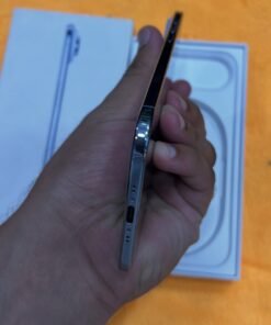 Bottom edge view of a Sky Blue iPhone 17 Air non pta showing the USB-C charging port, speaker grilles, and polished chassis frame.