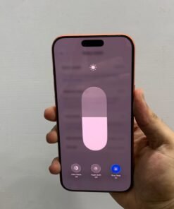 Front view of a copper orange iPhone 17 Pro max showing the screen brightness slider and True Tone settings.