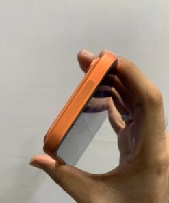Close-up angled view of the top right frame of a copper orange iPhone 17 Pro max showing the Camera Control sensor and camera plateau.