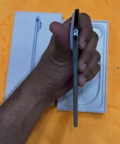Left side profile of a Sky Blue iPhone 17 Air non pta held in hand, displaying the Action button and volume keys along the thin side rail.