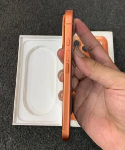 Left side profile view of a copper orange iPhone 17 Pro highlighting the Action button and volume keys.