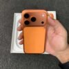 Full back view of a copper orange iPhone 17 Pro non pta showing the redesigned wide camera island with triple lenses.