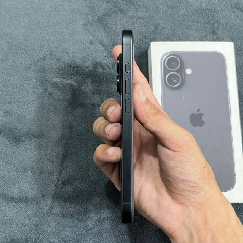 Left side profile of a Black iPhone 17 showing the Action Button, volume keys, and matte aluminum side frame.
