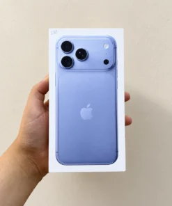Front view of a concept iPhone 18 Pro retail box in light periwinkle blue held in hand against a neutral wall backdrop.